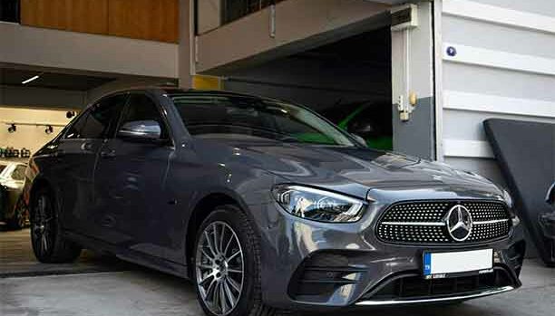 Mercedes-Benz being serviced at Finch Motors in Surrey, with technicians using specialist diagnostic tools.
